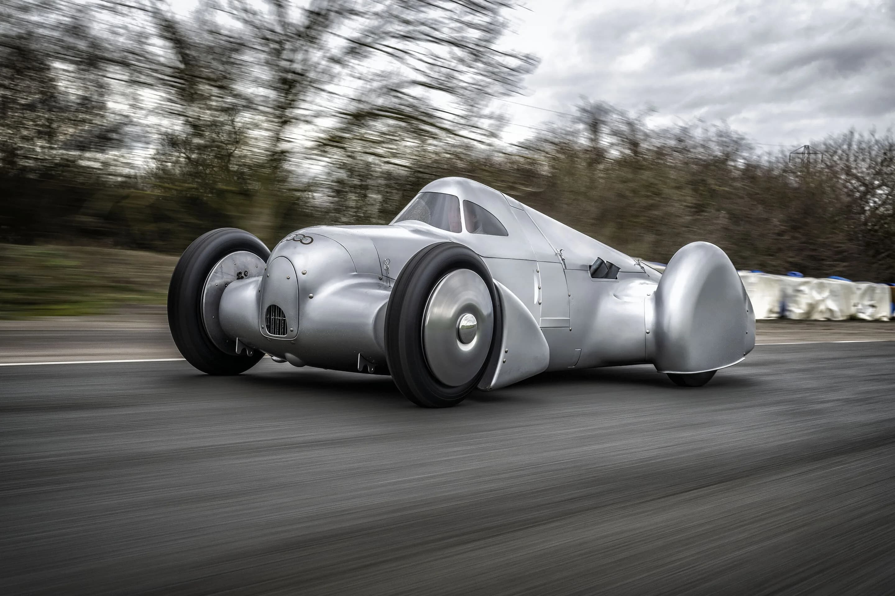 Auto Union Lucca - Audi recreated the Auto Union Lucca. After just over three years of construction, the record-breaking car was completed in early 2026.
Driving shot at the first roll-out. Side view.