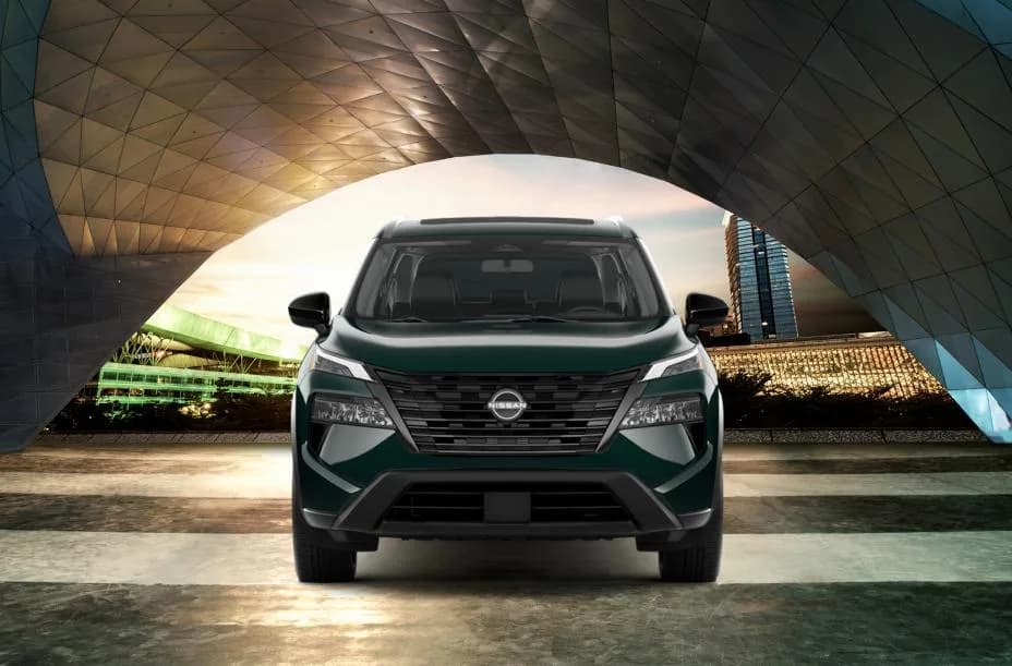 Front view of the 2026 Nissan Rogue Dark Armor under an architectural structure.