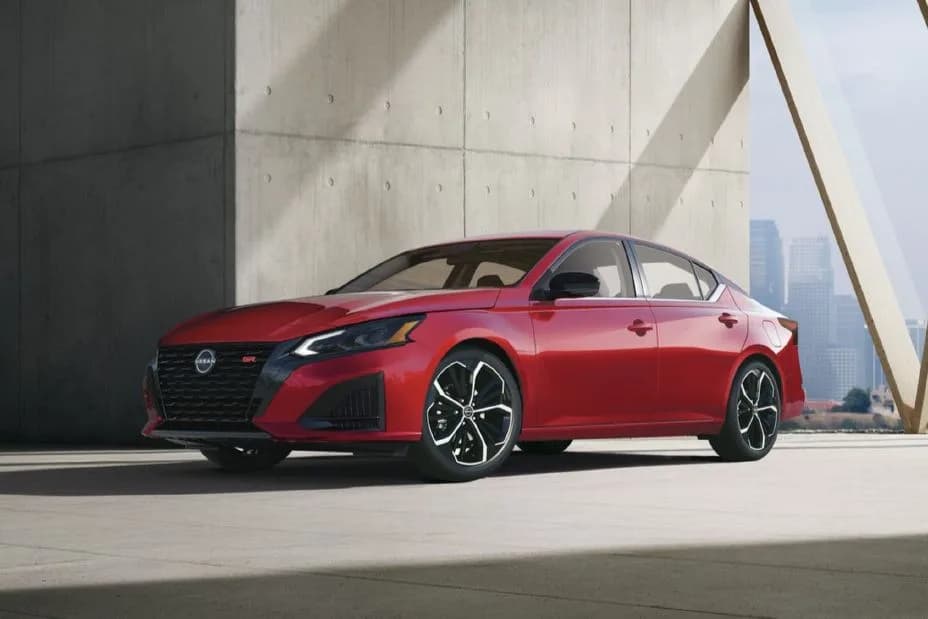 Front left 3/4 view of the 2027 Nissan Altima parked in front of a concrete wall.