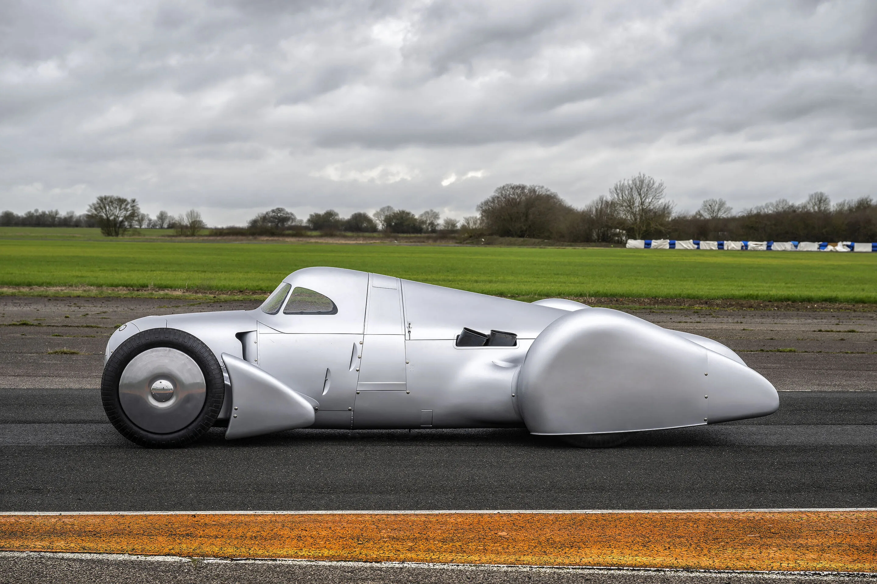 Auto Union Lucca - Audi recreated the Auto Union Lucca. After just over three years of construction, the record-breaking car was completed in early 2026.
Driving shot at the first roll-out. Side view.
