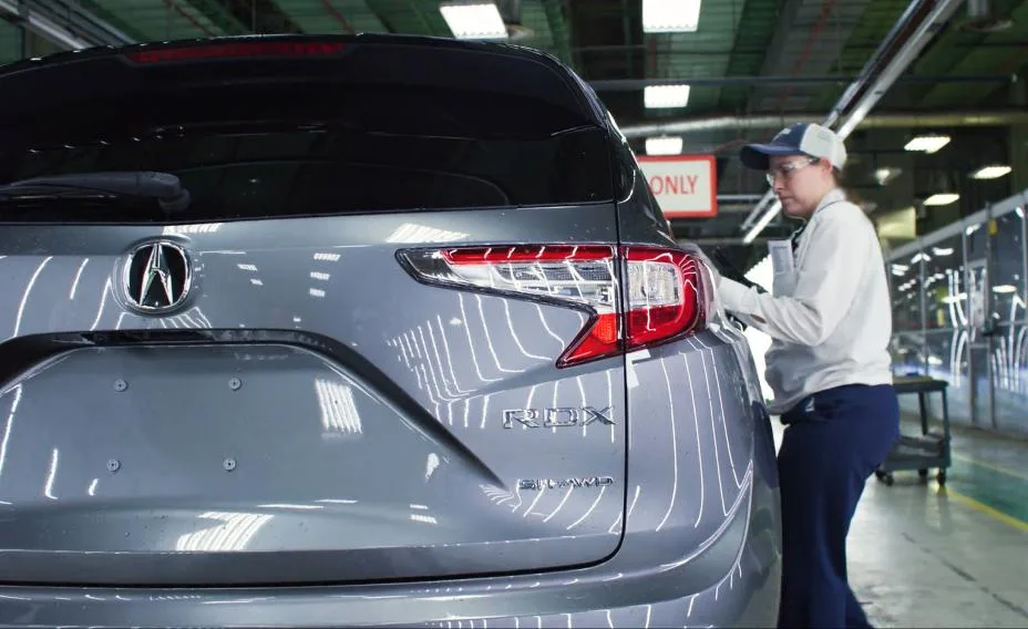 A Honda associate at the East Liberty Auto Plant checks the fit and finish of the 2026 Acura RDX, which was the 16th-best vehicle in this year’s Cars.com American-Made Index