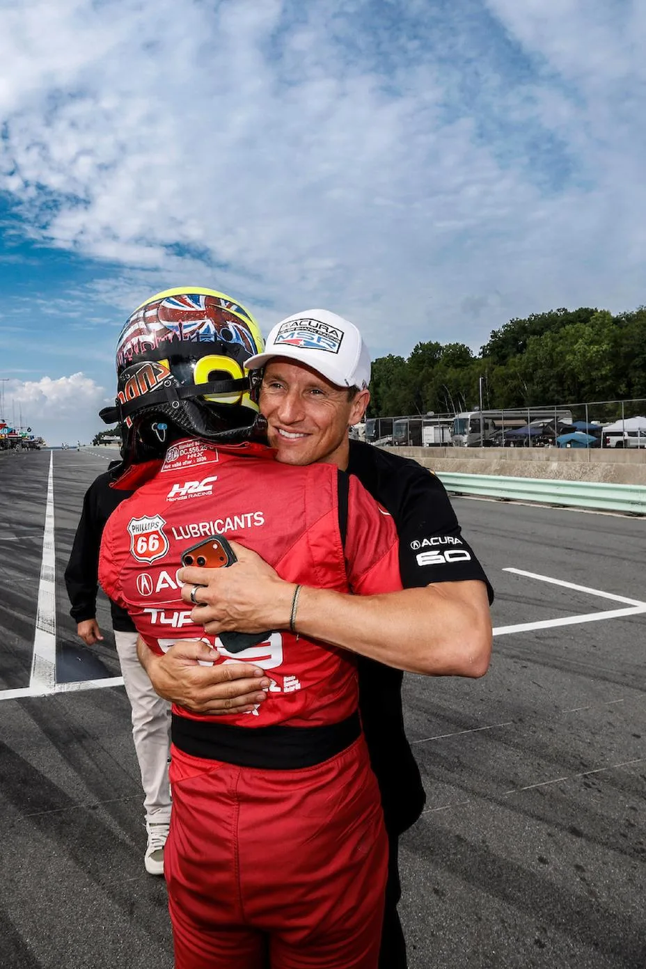 Pole Award winner #93: Acura Meyer Shank Racing w/Curb Agajanian, Acura ARX-06, GTP: Nick Yelloly celebrates with teammate Renger van der Zande