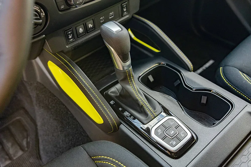 Close up of the gear shift inside the 2027 Nissan Frontier Sport Edition.