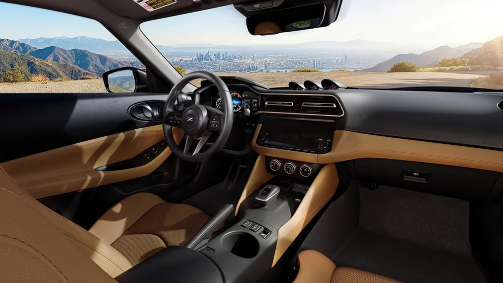 View of the dashboard, steering and windshield inside the Nissan Z.