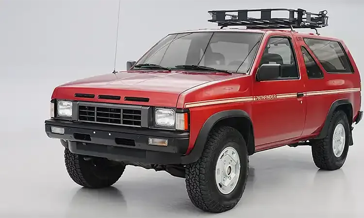 3/4 view of a Red Nissan Pathfinder