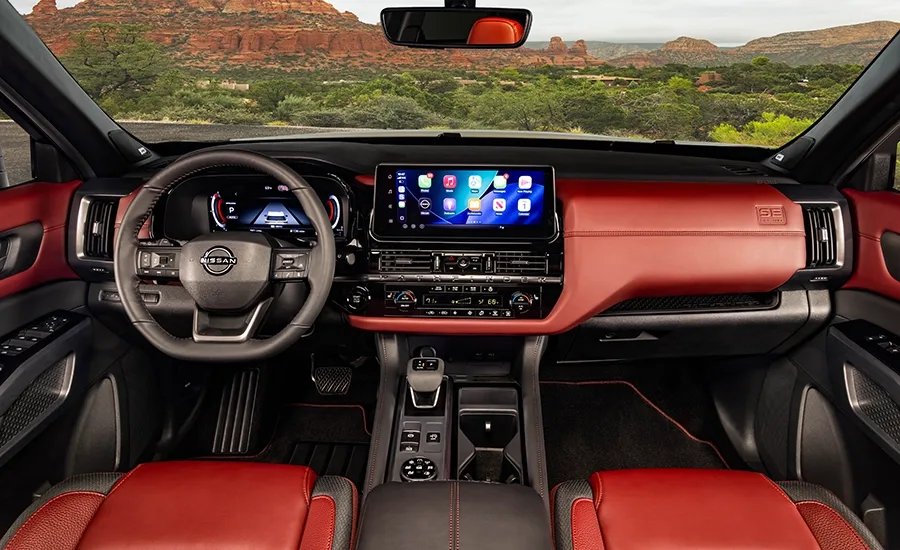 The steering wheel, dashboard and windshield inside the 2027 Nissan Pathfinder Special Edition.