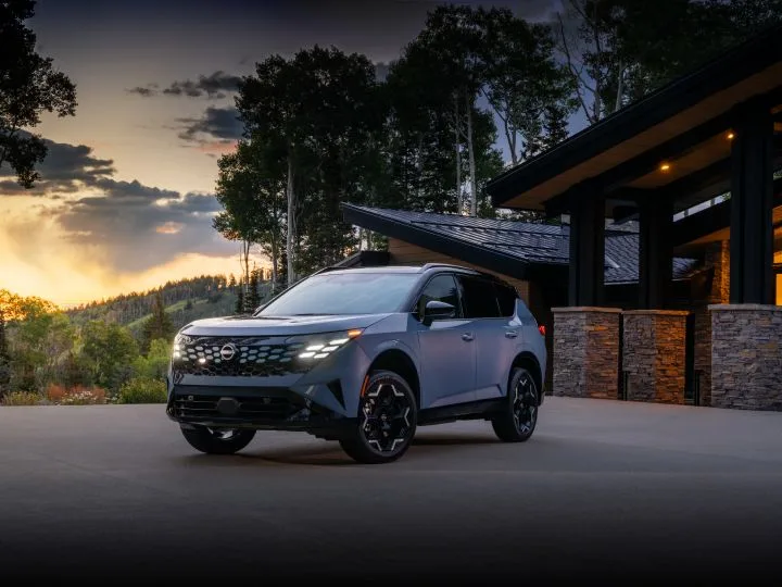Front left 3/4 view of the 2027 Nissan Rogue Hybrid Platinum at sunset.